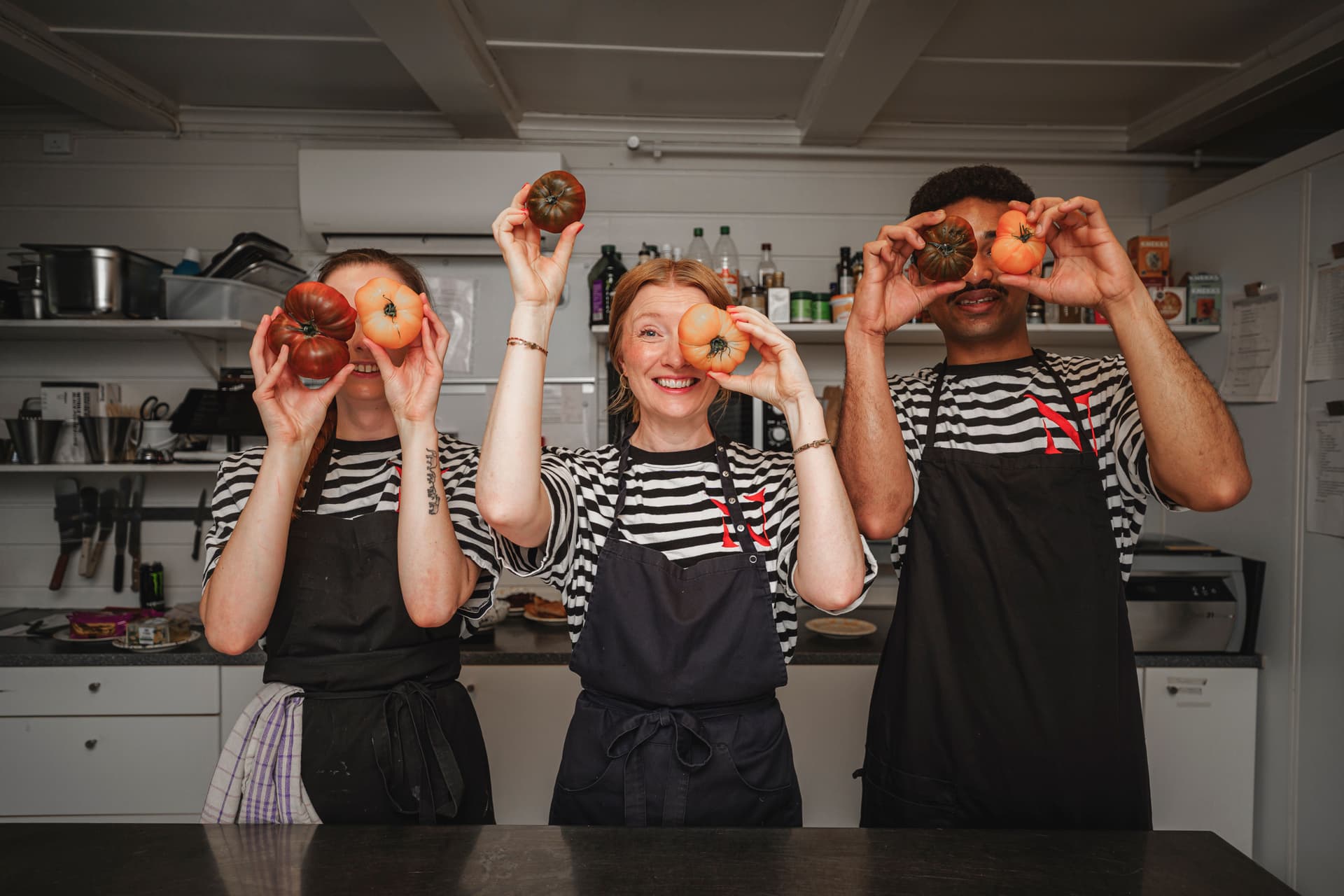 Cafe staff smiling outside.